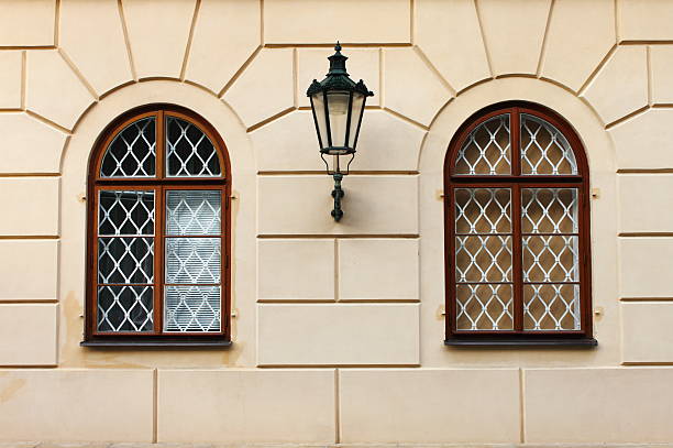 Renaissance windows Renaissance windows with iron street lamp in Prague, Czech Republic