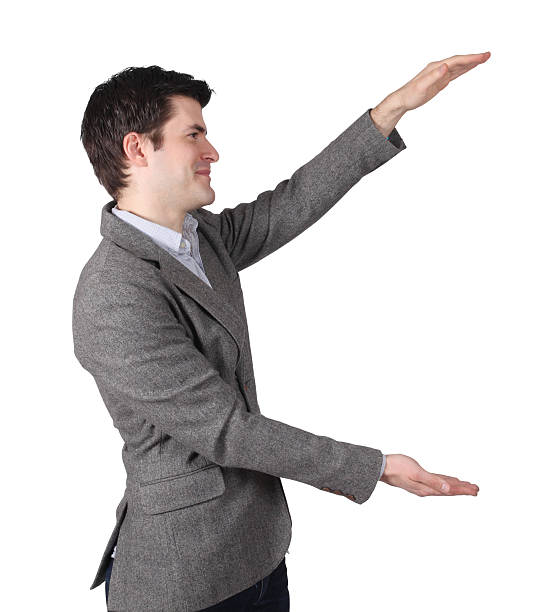 istock Businessman presenting something large to his left 176015896