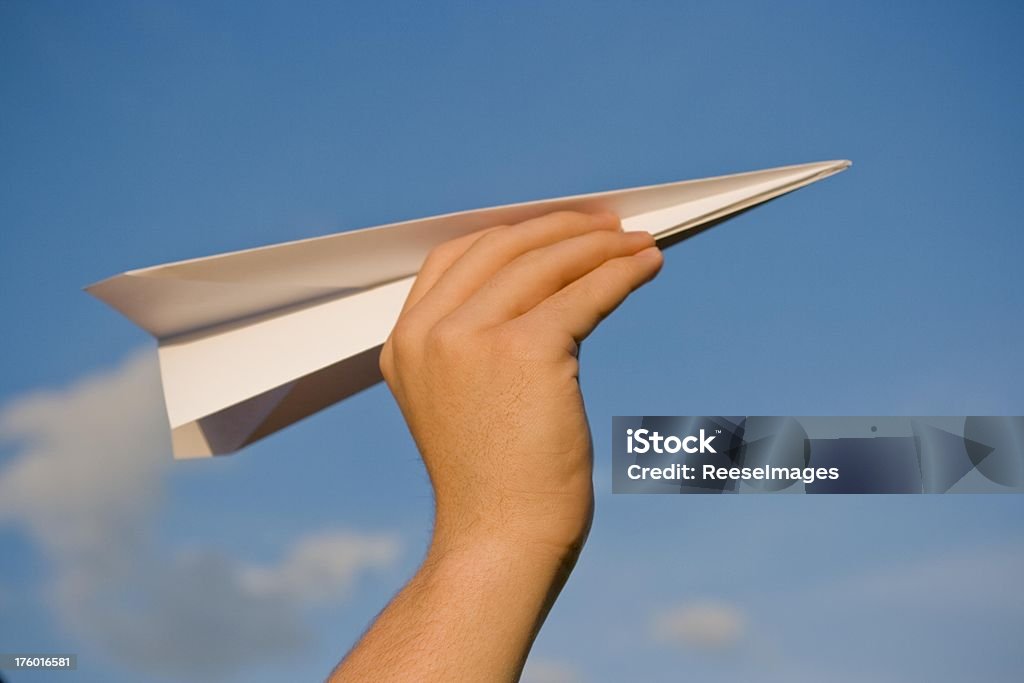 Airplane Person about to throw a paper airplne. Achievement Stock Photo