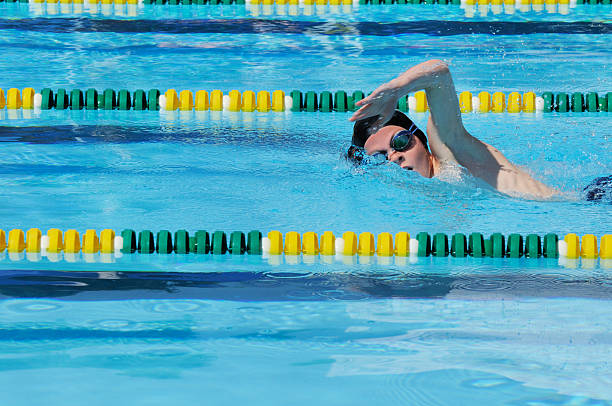 istock Young Boy Freestyle Swimmer Racing in Pool 176016938