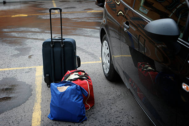 Suitcases near a car