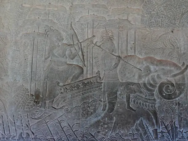 Detail of the extensive wall relief sculptures on the temple of Ankor Wat, Cambodia.