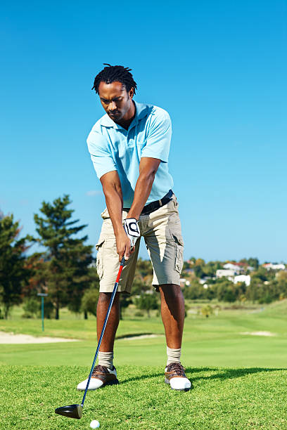 istock African American golfer getting ready to tee off 176018144