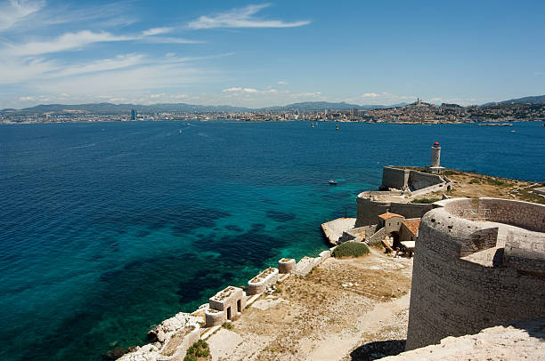 Marseille View of Marseille from the Chateau D'if Island. Notre Dame Grande Cathedral in the distance. frioul archipelago stock pictures, royalty-free photos & images