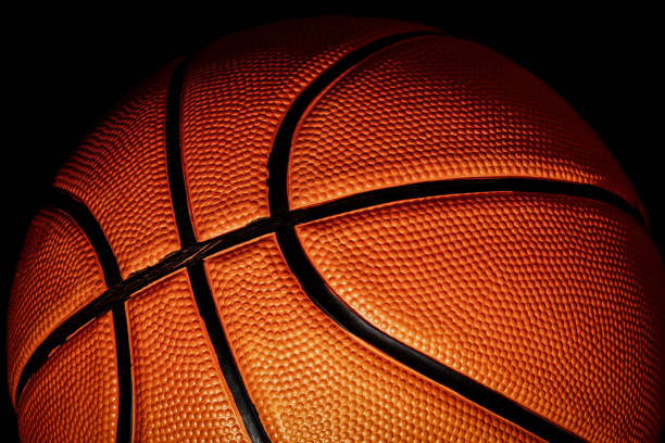 Bright leather orange basketball with highlights and shadow Bright leather orange basketball with highlights and shadow. Streetball and hoops theme backgrounds asphalt basketball court stock pictures, royalty-free photos & images