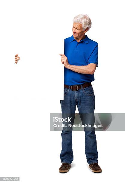 Foto de Homem Sênior Olhando Em Branco Sinal Isolado e mais fotos de stock de 60 Anos - 60 Anos, Adulto, Azul