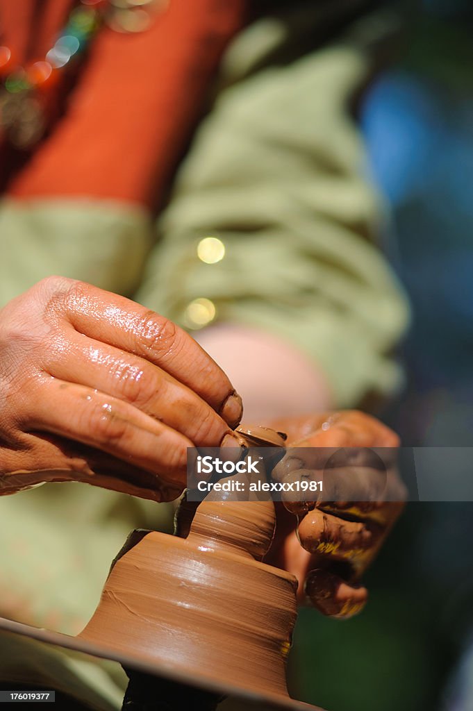 potter makes a jug out of clay Adjusting Stock Photo