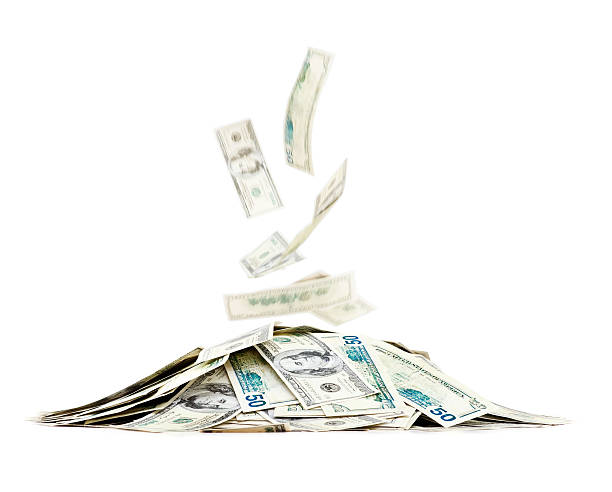 istock Banknotes falling on a pile of money. 176019567