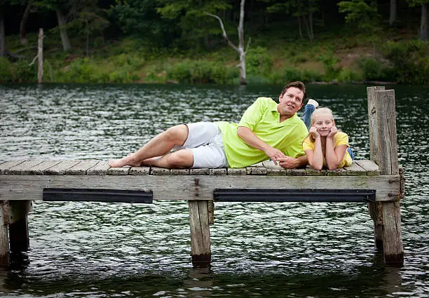 Father and Daughter on a Dock.