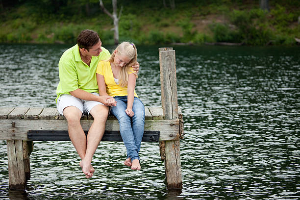 istock Father Comforting his Daughter on a Dock 176020285