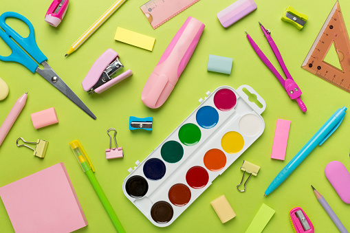 Flat lay with colorful school stationery on color backgroung, top view