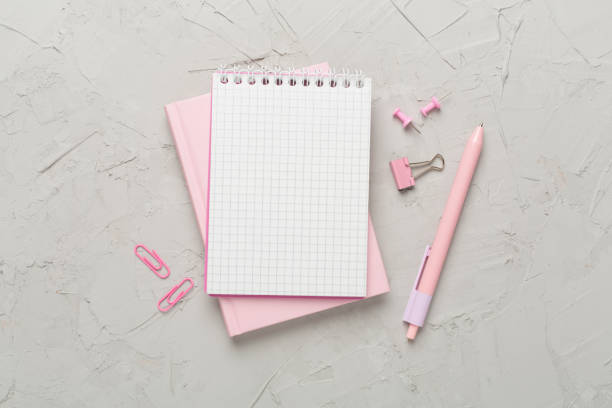 istock Notebooks with stationery on concrete background, top view 1760203094