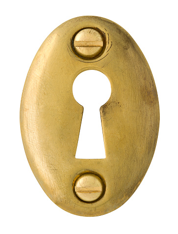 Keyhole in old oval brass Escutcheon on white with Clipping Path inside and out - nice detail in this. Large Hi-Res image is about 6\