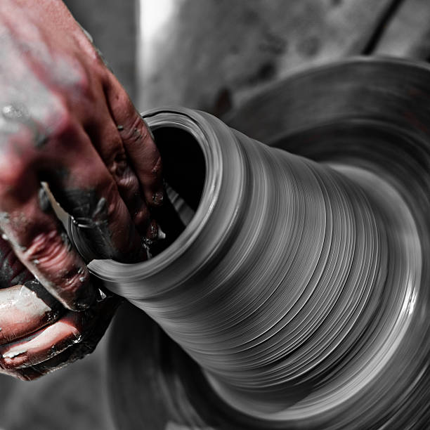 istock potter makes a jug out of clay 176020455