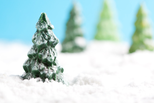 Miniature snowy winter landscape with copy space and christmas trees. You may also like: