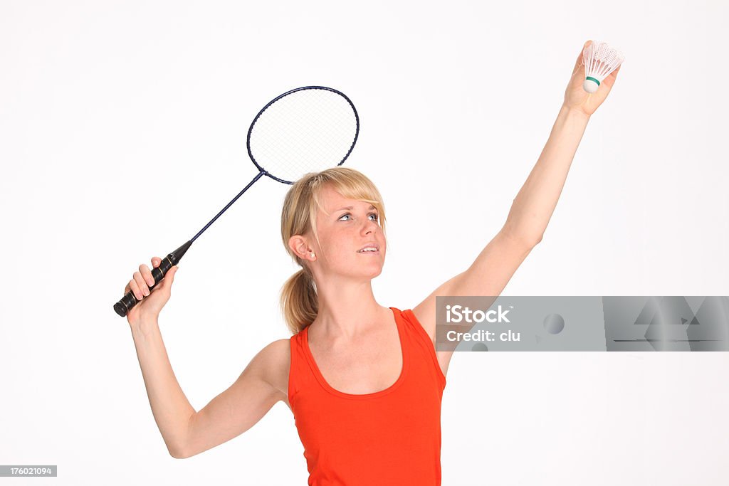Giovane donna giocare a badminton - Foto stock royalty-free di Adulto