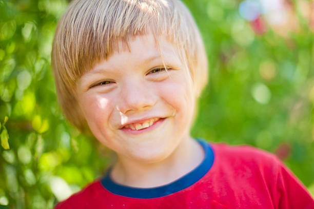 istock Happy smiling young boy looking at camera 176021698
