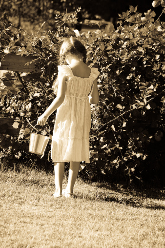 Little girl with a tin pail picking blackberries. Antiqued for a vintage feel. Click photo below to see more of this model.
