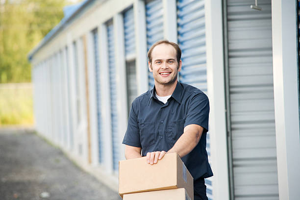 Man with Boxes Moving Company at Self Storage stock photo