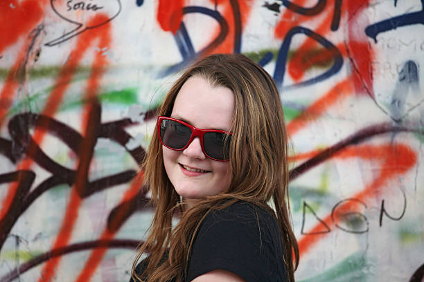 istock Female teenager on graffiti background 176022589