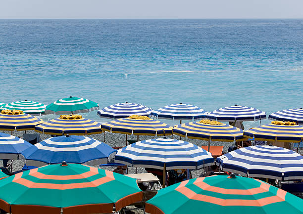 istock Blue water with sun umbrellas 176022705