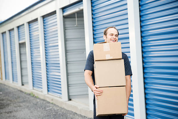 Man with Boxes Moving Company at Self Storage stock photo