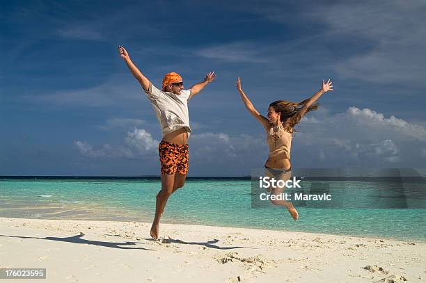 Couple On The Beach Stock Photo - Download Image Now - Active Lifestyle, Adult, Adults Only