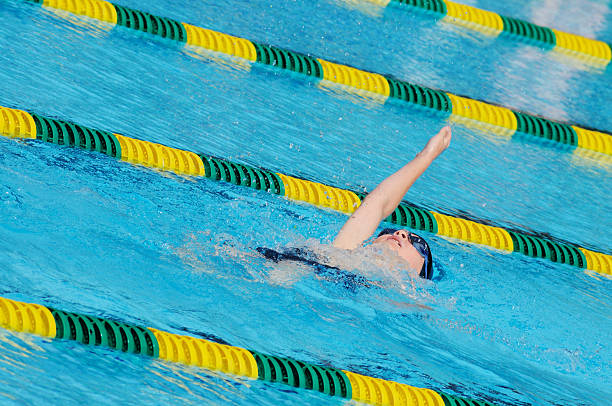 istock Young Boy Backstroke Swimmer Racing in Pool 176024688