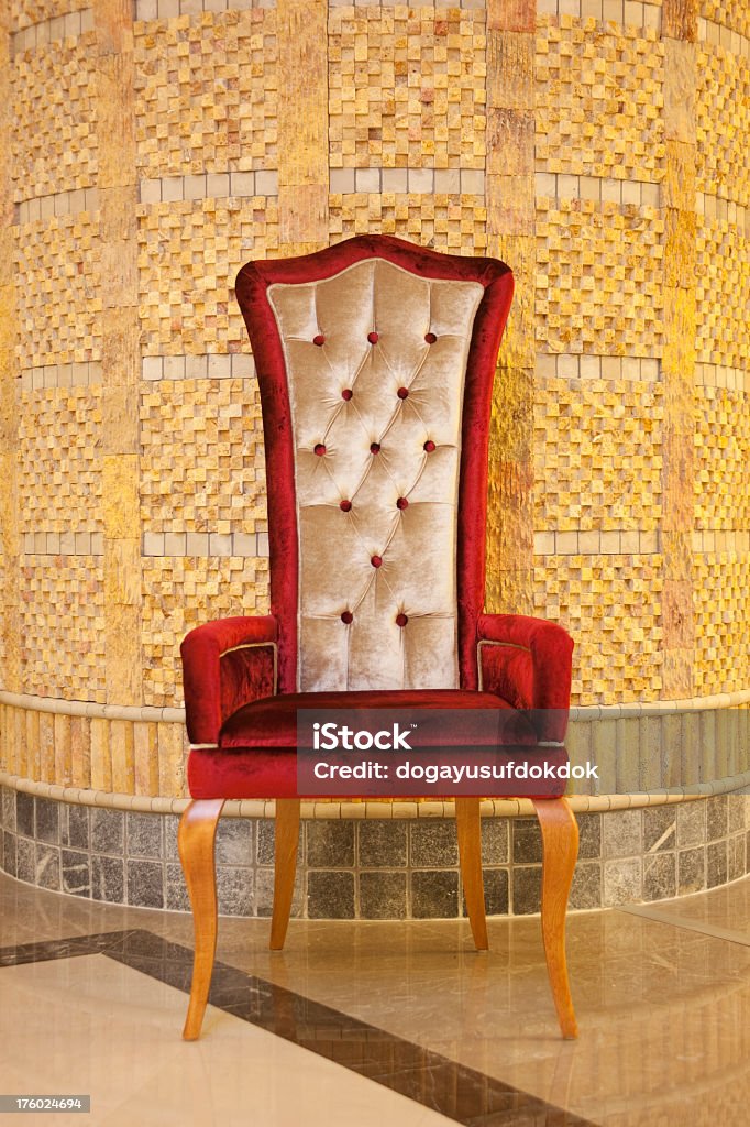 Red Velvet Armchair Red Velvet Armchair, Classic interior decoration and marble floor. Architectural Detail and handmade furniture... Antique Stock Photo