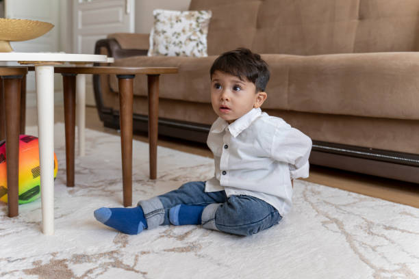 istock Boy playing with soccer ball at home. 1760249345