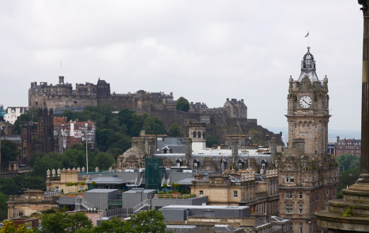 Edinburgh Castle on a typical Grey Scottish Morning as viewed from Calton Hill.The clock tower on the right is the famous Balmoral Hotel.