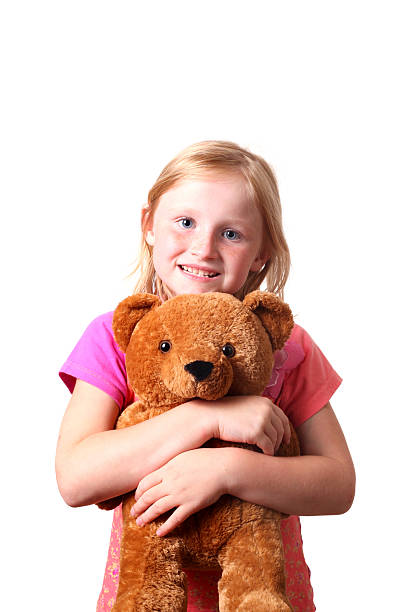 istock girl with teddy bear 176025481