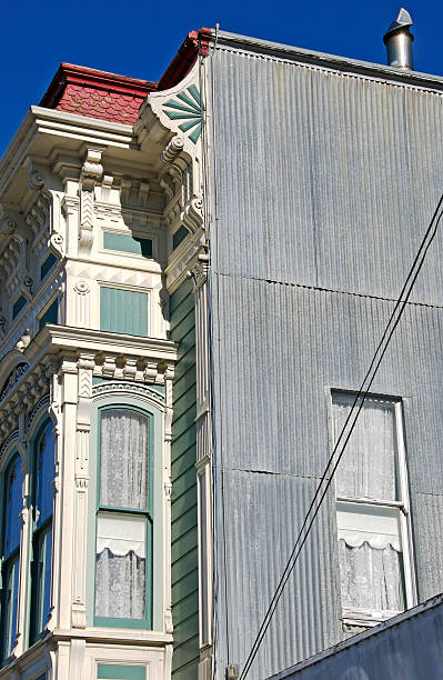 istock Building's Victorian facade and metal siding 176026112
