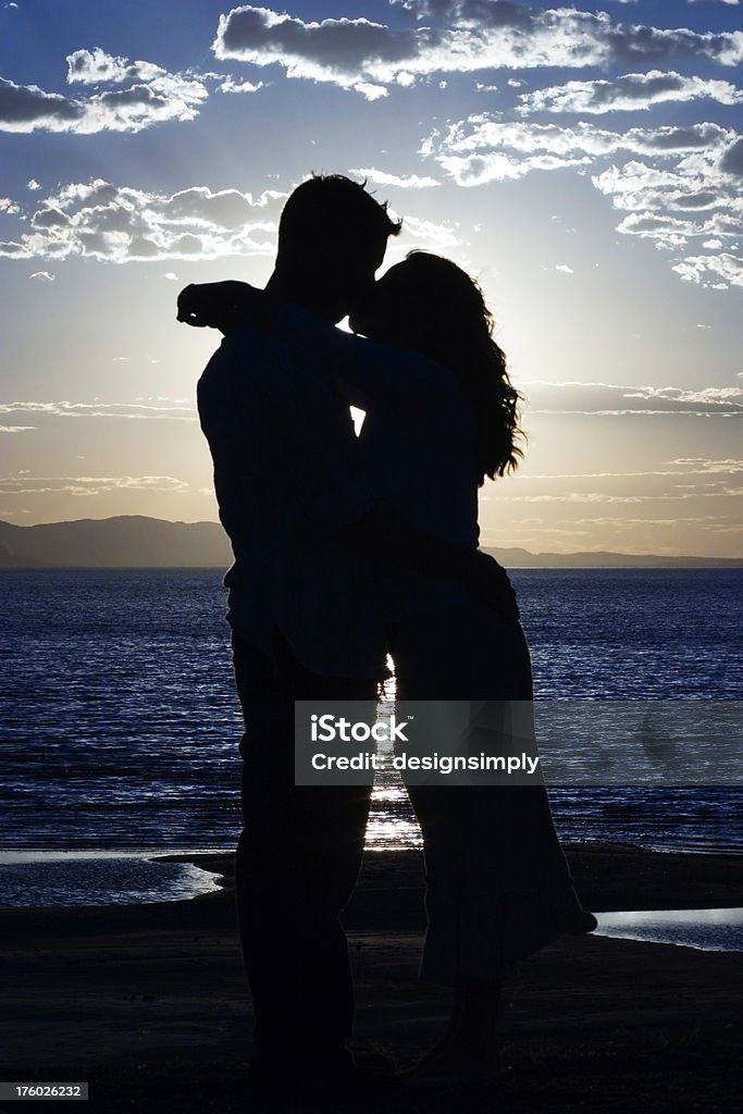 Romantic Silhouetted Kiss A very romantic kiss. Adult Stock Photo