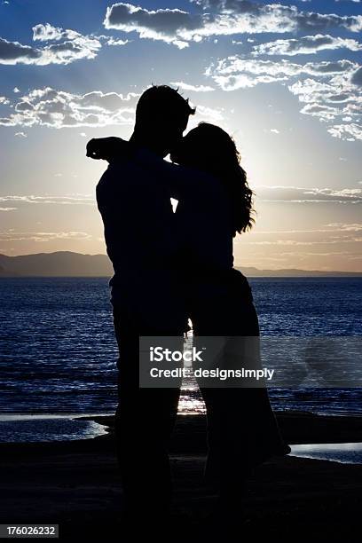 Romantic Silhouetted Kiss Stock Photo - Download Image Now - Adult, Awe, Beautiful People