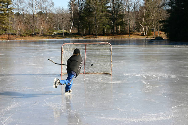 istock pond hockey wrist shot 176026238