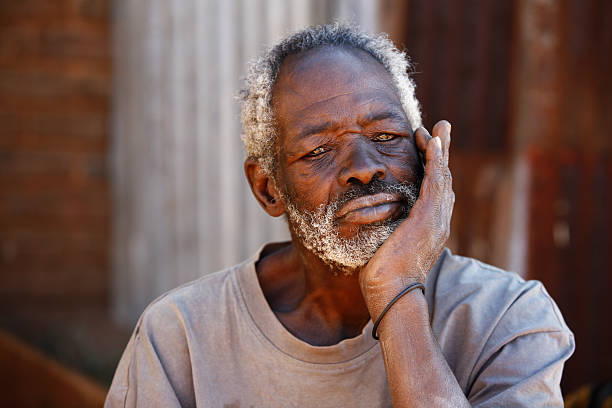 istock Bored old African shack dweller 176026678