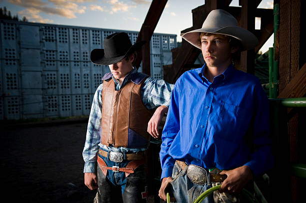 istock Young Rodeo Cowboys at sunset in Colorado 176026890