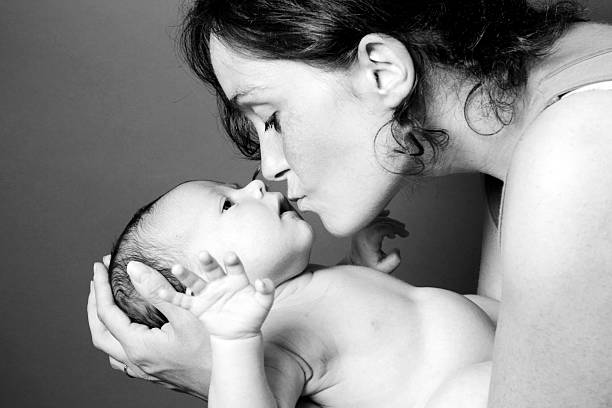 istock Mother kissing her baby 176027097
