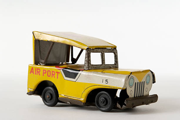 istock Isolated shot of rusty tin toy Jeep on white background 176027419