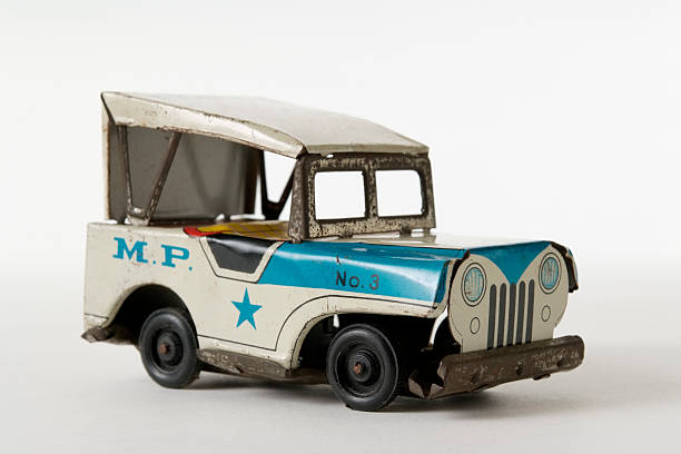 istock Isolated shot of rusty tin toy Jeep on white background 176027568