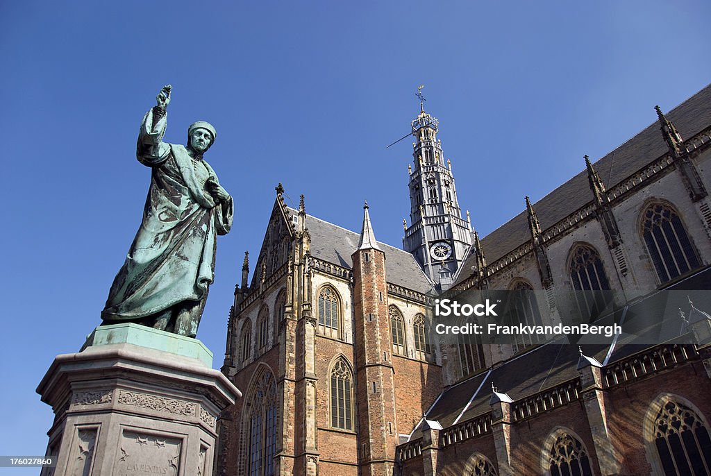 Dutch city of Haarlem "Old statue at the main square of haarlem, the Netherlands. Representing ""Laurens Janszoon Coster"" who invented the art of book printing according to the Dutch. Statue was made in 1856. In the background the Old Bavo church.Related images;" Antique Stock Photo