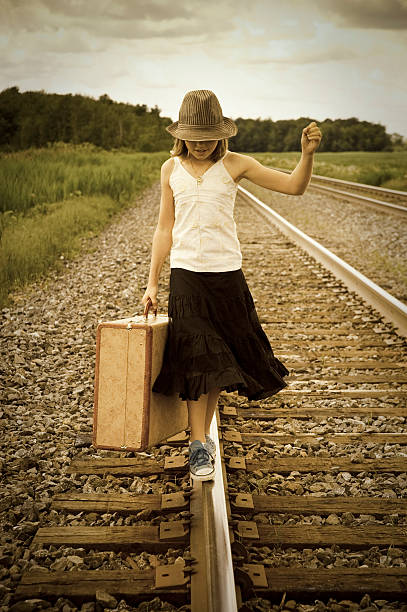 istock Old fashioned kids on a railroad 176027904