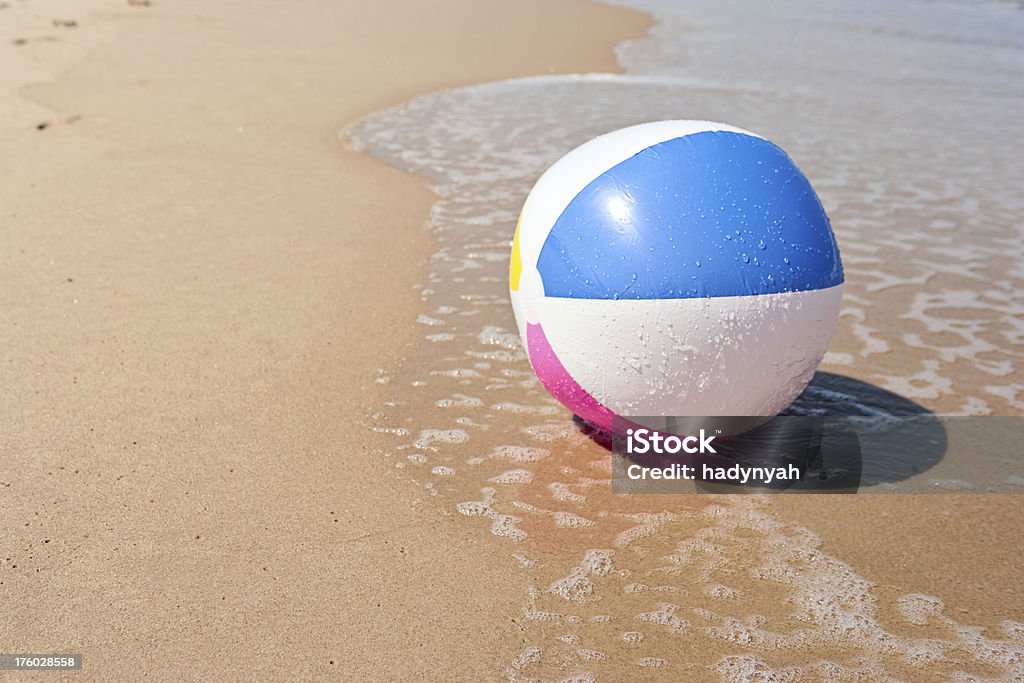 Beach ball Colorful beach ball, sand &amp; sea Beach Ball Stock Photo