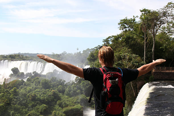 istock Man Looking at the Iguacu Waterfalls, Argentina 176028805