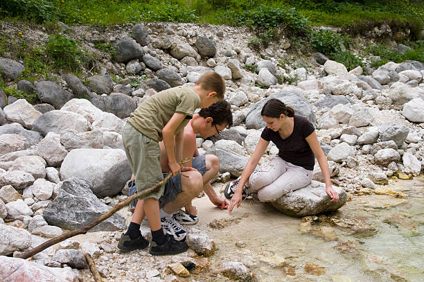 istock Father playing with children - riverbank 176028835
