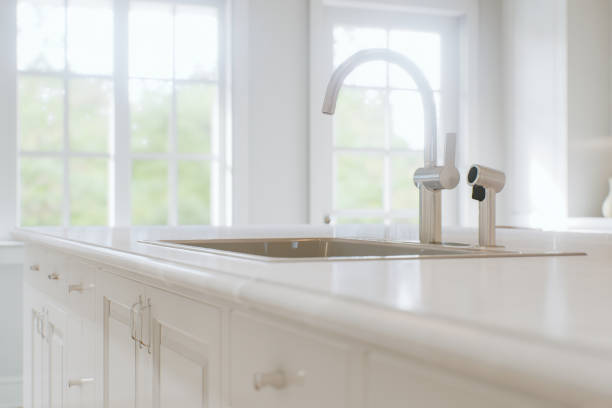istock Kitchen white countertop with white marble, with blurred bokeh background. Presentation of goods in the kitchen interior on the countertop surface. 3D rendering 1760298804