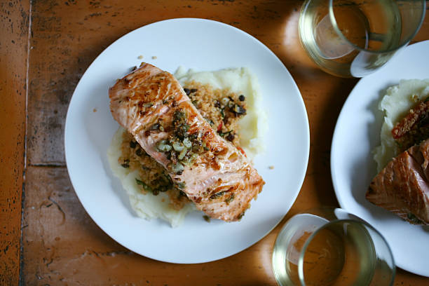 Pan roasted salmon with quinoa and mashed potatoes stock photo