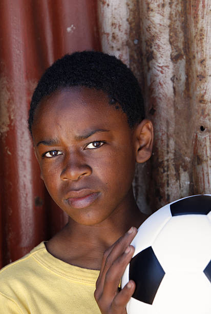 istock Black child with a football 176030045
