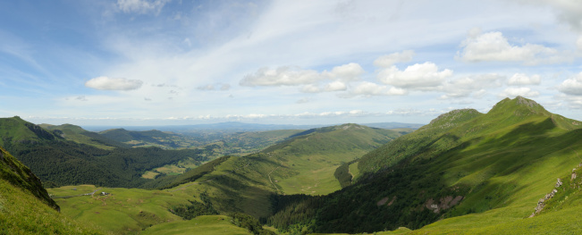 Panorama of the landscape formed by volcanoes. The pictures was taken in july 2009 and shows the Puy de la Tourte at the left and the Puy Peyre Arse at the right side. I was standing at the slopes of Puy Mary.The upper end of Santoire valley.Stiched with 6 captures.Similar pictures from Auvergne